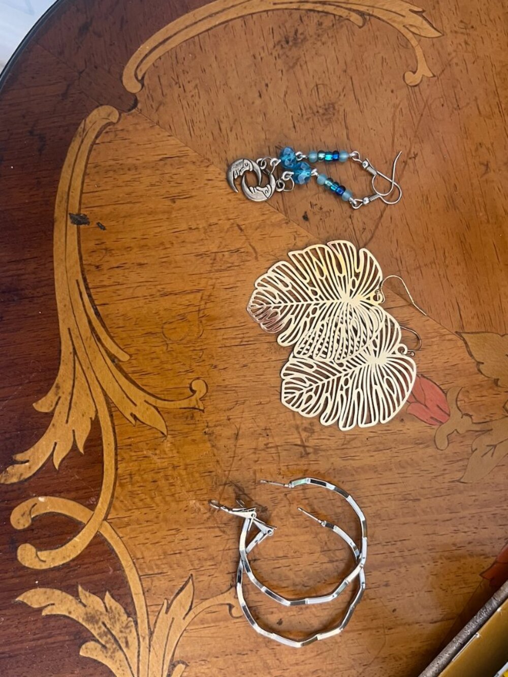 Bundle of dangly earrings: Blue, silver, gold